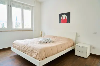 Letto o letti in una camera di Casa Rosita Spazio Comfort e Relax 130mq con 3 Camere