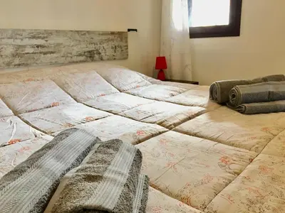 Letto o letti in una camera di Albachiara