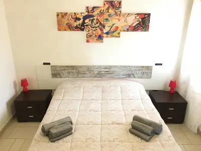 Letto o letti in una camera di Albachiara