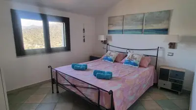 Letto o letti in una camera di Villetta with heated pool and panoramic view
