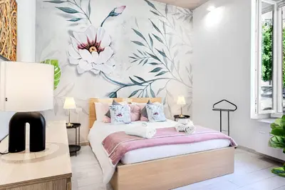 Letto o letti in una camera di Benny's rose house