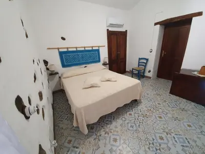 Letto o letti in una camera di Casa Vacanza Sa Prenda