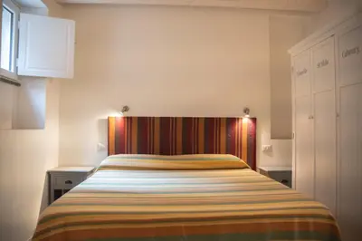 Letto o letti in una camera di L'Approdo Bilocale