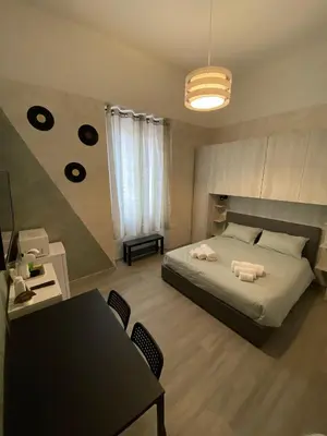 Letto o letti in una camera di B&B La Sinfonia
