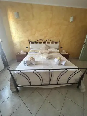 Letto o letti in una camera di Villa di Cristina