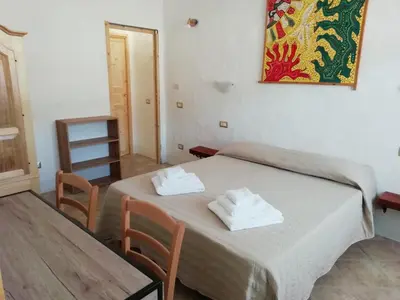 Letto o letti in una camera di Beni Benìus