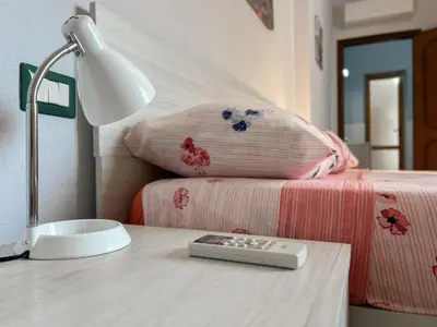 Letto o letti in una camera di 10 minuti dal mare- Casa Vacanze Martina