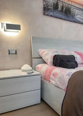 Letto o letti in una camera di 10 minuti dal mare- Casa Vacanze Martina