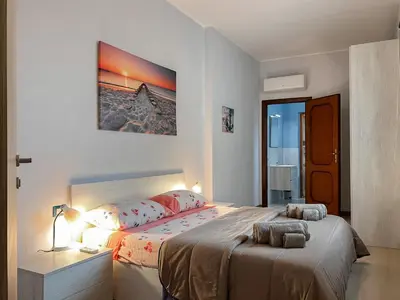 Letto o letti in una camera di 10 minuti dal mare- Casa Vacanze Martina