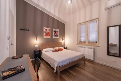 Letto o letti in una camera di 3 MURA rooms