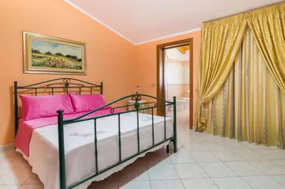 Letto o letti in una camera di Casa Titti