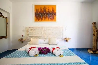 Letto o letti in una camera di Suites Voce del Mare