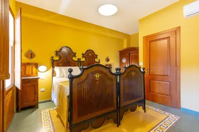 Letto o letti in una camera di B&B ANTICA KALAGONIS