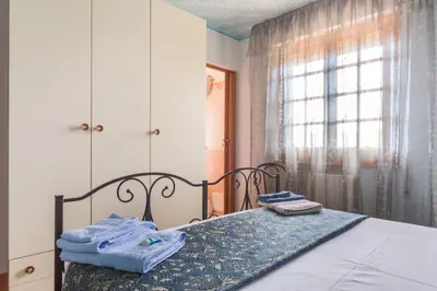 Letto o letti in una camera di B&B Il Mirto