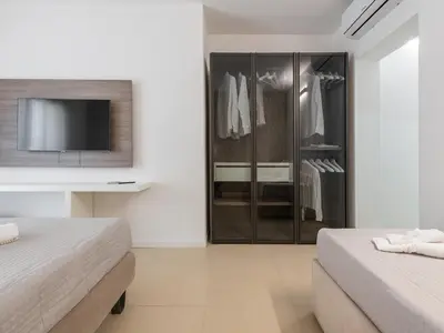 Letto o letti in una camera di Palazzo Michelangelo