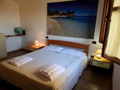 Letto o letti in una camera di Casa Cala Luna
