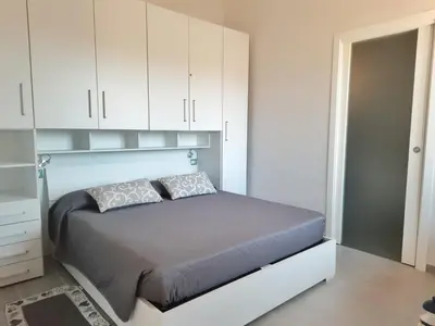 Letto o letti in una camera di Monolocale Arbus R0478