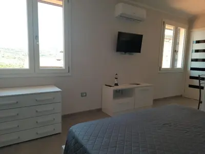 Letto o letti in una camera di Monolocale Arbus R0478
