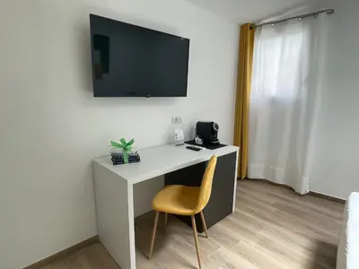 TV o dispositivi per l'intrattenimento presso Admayora Guest House