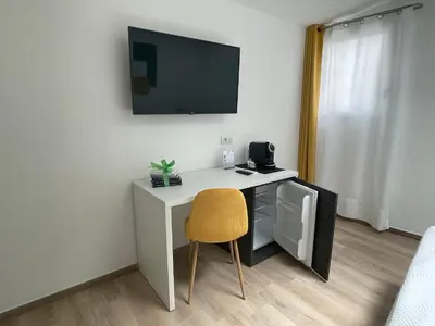 TV o dispositivi per l'intrattenimento presso Admayora Guest House