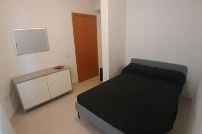 Letto o letti in una camera di Casetta Emma, trilocale Elmas, areoporto elegante silenzioso