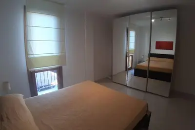 Letto o letti in una camera di Casetta Emma, trilocale Elmas, areoporto elegante silenzioso