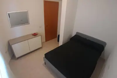Letto o letti in una camera di Casetta Emma, trilocale Elmas, areoporto elegante silenzioso