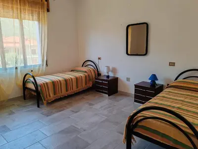 Letto o letti in una camera di Appartamento Monte Argentu