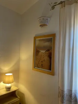 Letto o letti in una camera di Villa Amantea