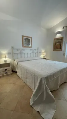 Letto o letti in una camera di Villa Amantea