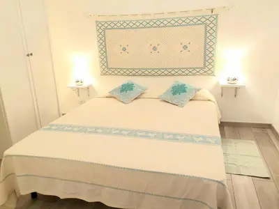 Letto o letti in una camera di I love Ogliastra Apartments IUN Q4332