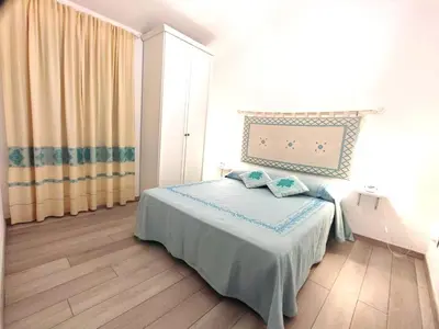 Letto o letti in una camera di I love Ogliastra Apartments IUN Q4332