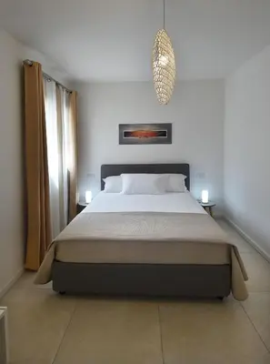 Letto o letti in una camera di Home Suite LE MONDE