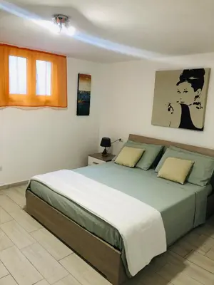 Letto o letti in una camera di VILLA AMBRA