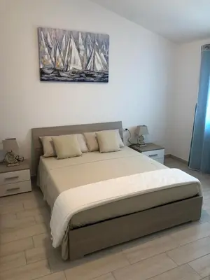 Letto o letti in una camera di VILLA AMBRA