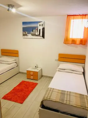 Letto o letti in una camera di VILLA AMBRA