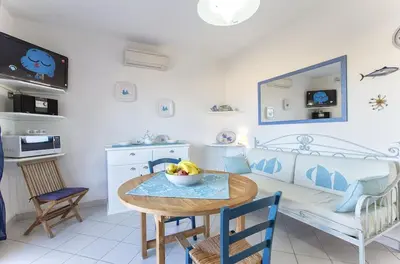 Cucina o angolo cottura di Costa Verde, Torre dei Corsari with a terrace overlooking the sea and close to the pristine dunes
