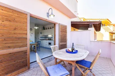 Cucina o angolo cottura di Costa Verde, Torre dei Corsari with a terrace overlooking the sea and close to the pristine dunes