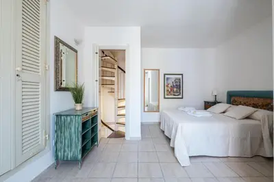 Letto o letti in una camera di ⭑⭑⭑⭑⭑La perla Rosa nel centro storico a Carloforte