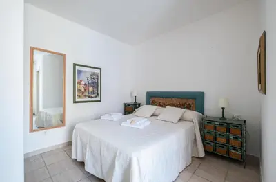 Letto o letti in una camera di ⭑⭑⭑⭑⭑La perla Rosa nel centro storico a Carloforte