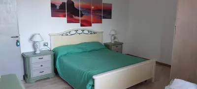 Letto o letti in una camera di Alba Mozzafiato