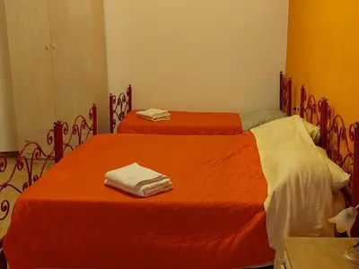 Letto o letti in una camera di Alba Mozzafiato