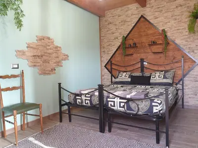 Letto o letti in una camera di Stanza Del Viggiatore