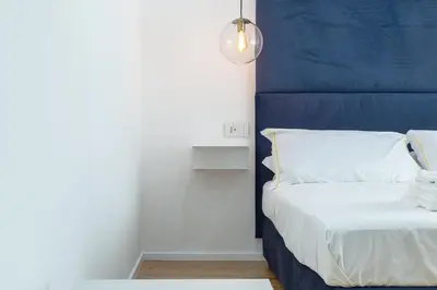 Letto o letti in una camera di ALMi