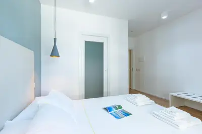 Letto o letti in una camera di ALMi