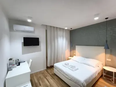 Letto o letti in una camera di ALMi