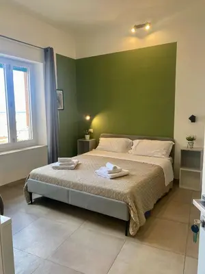 Letto o letti in una camera di ISTAI Cagliari City Center Rooms