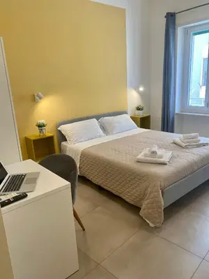 Letto o letti in una camera di ISTAI Cagliari City Center Rooms