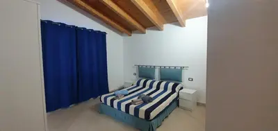 Letto o letti in una camera di Villa Piscinas