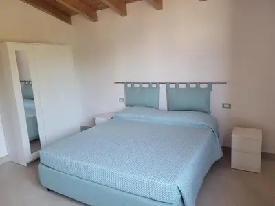 Letto o letti in una camera di Villa Piscinas